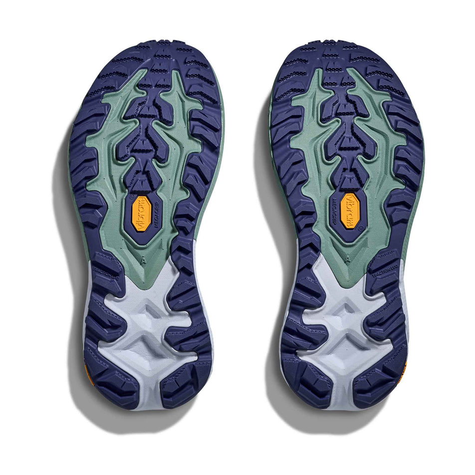 The outsoles of a pair of HOKA Women's Mafate 5 Running Shoes in the Ambient Blue/Rosemary colourway.