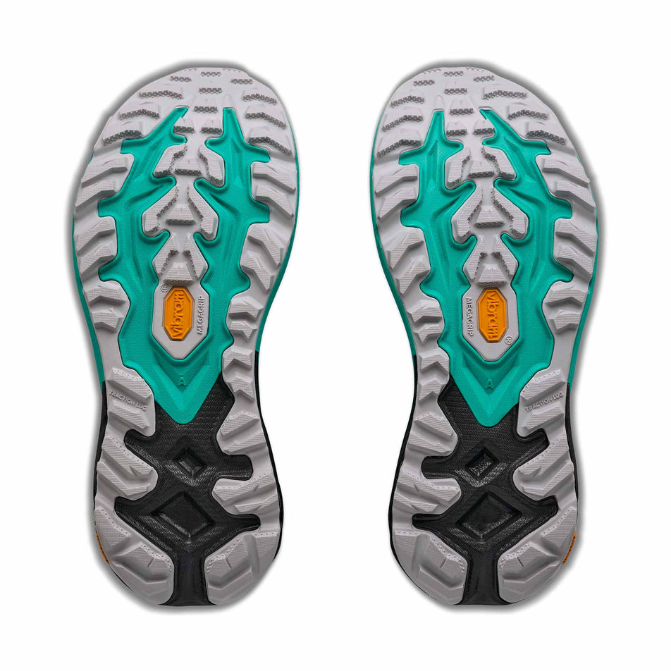 The outsoles of a pair of HOKA Women's Mafate 5 Trail Running Shoes in the Black/Electric Aqua colourway.