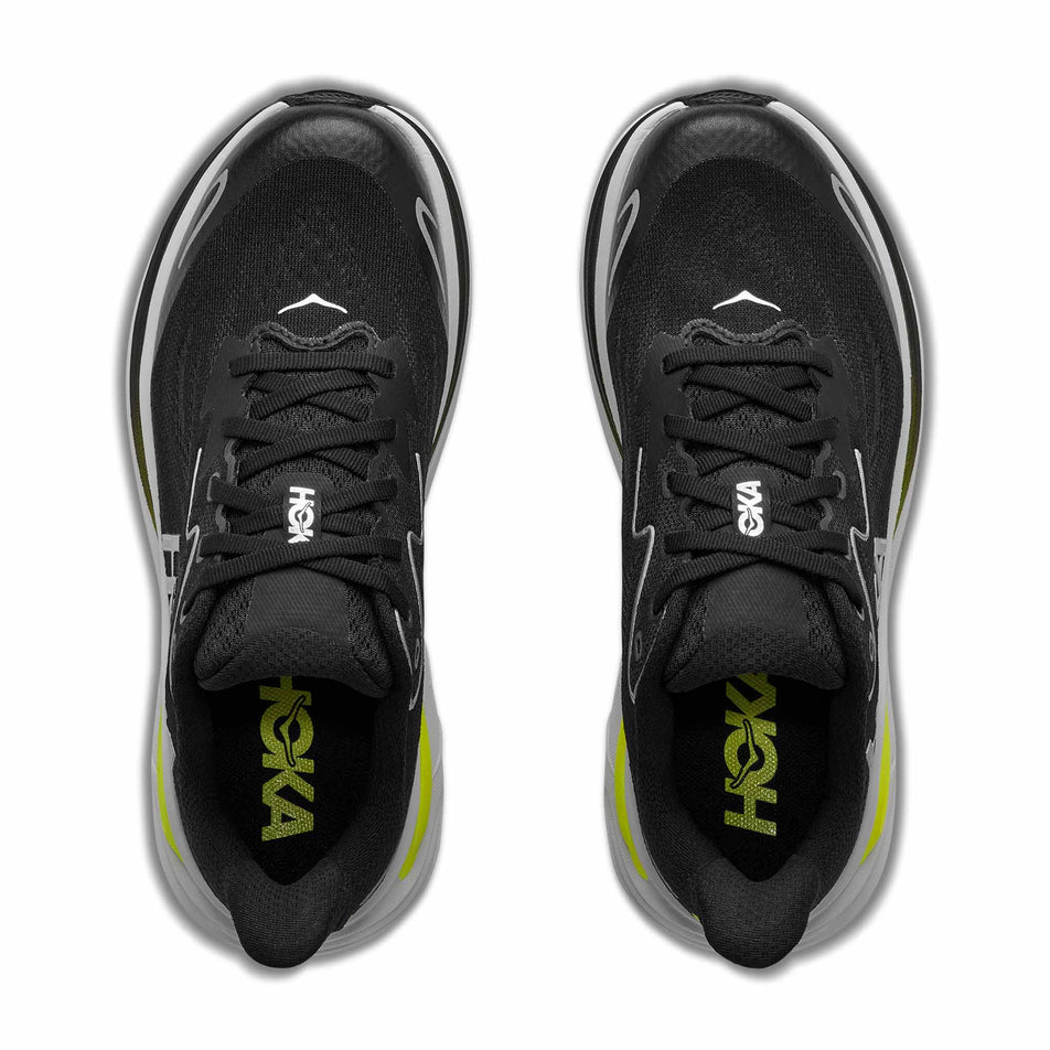The uppers of a pair of HOKA Clifton 10 Big Kids Running Shoes in the Black/Cosmic Grey colourway.