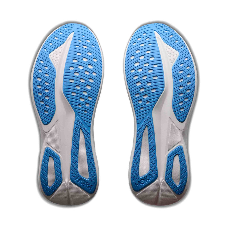 The outsoles of a pair of HOKA Men's Mach 7 Running Shoes in the Virtual Blue/Soft Cobalt colourway.