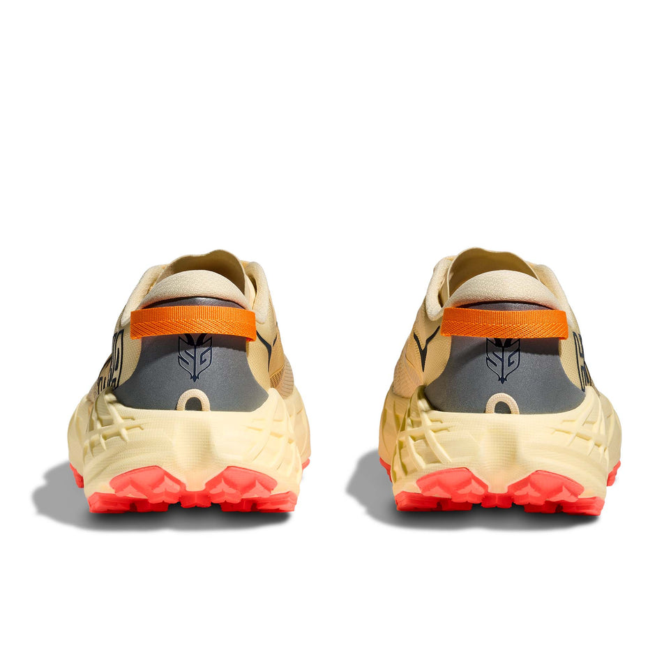 The back of a pair of HOKA Women's Speedgoat 7 Running Shoes in the Vintage Yellow/Neon Flame colourway.