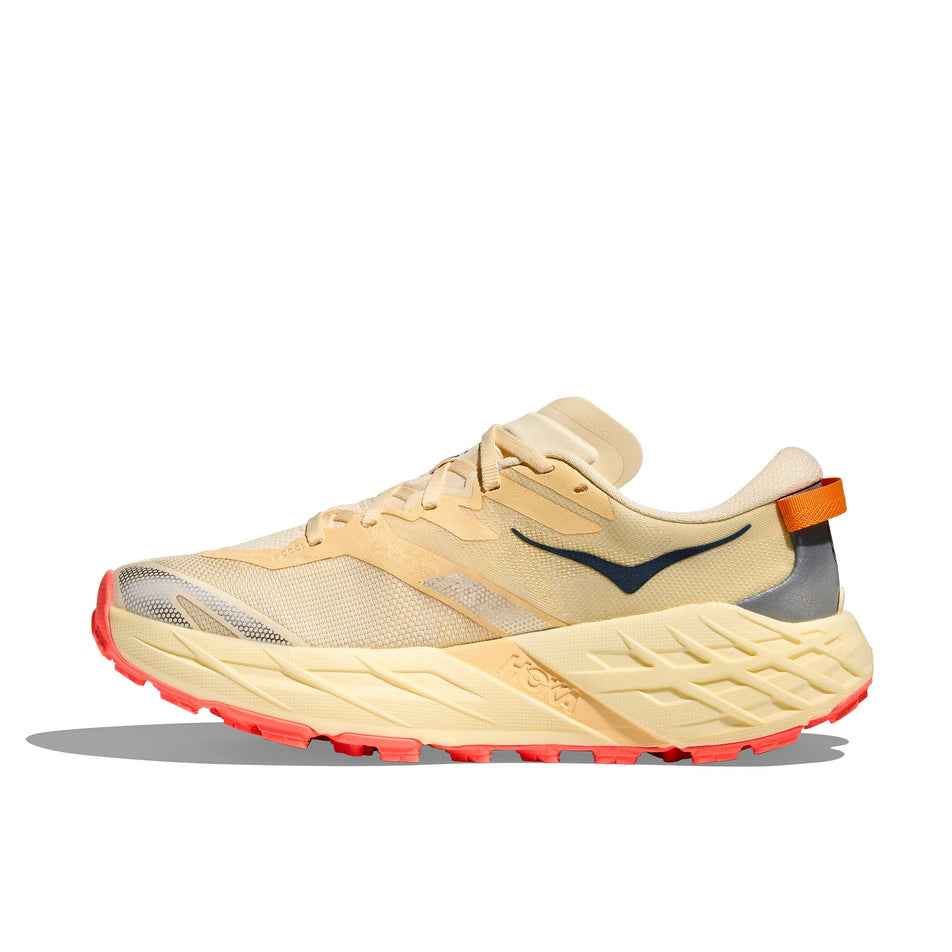 Medial view of the right shoe from a pair of HOKA Women's Speedgoat 7 Running Shoes in the Vintage Yellow/Neon Flame colourway.