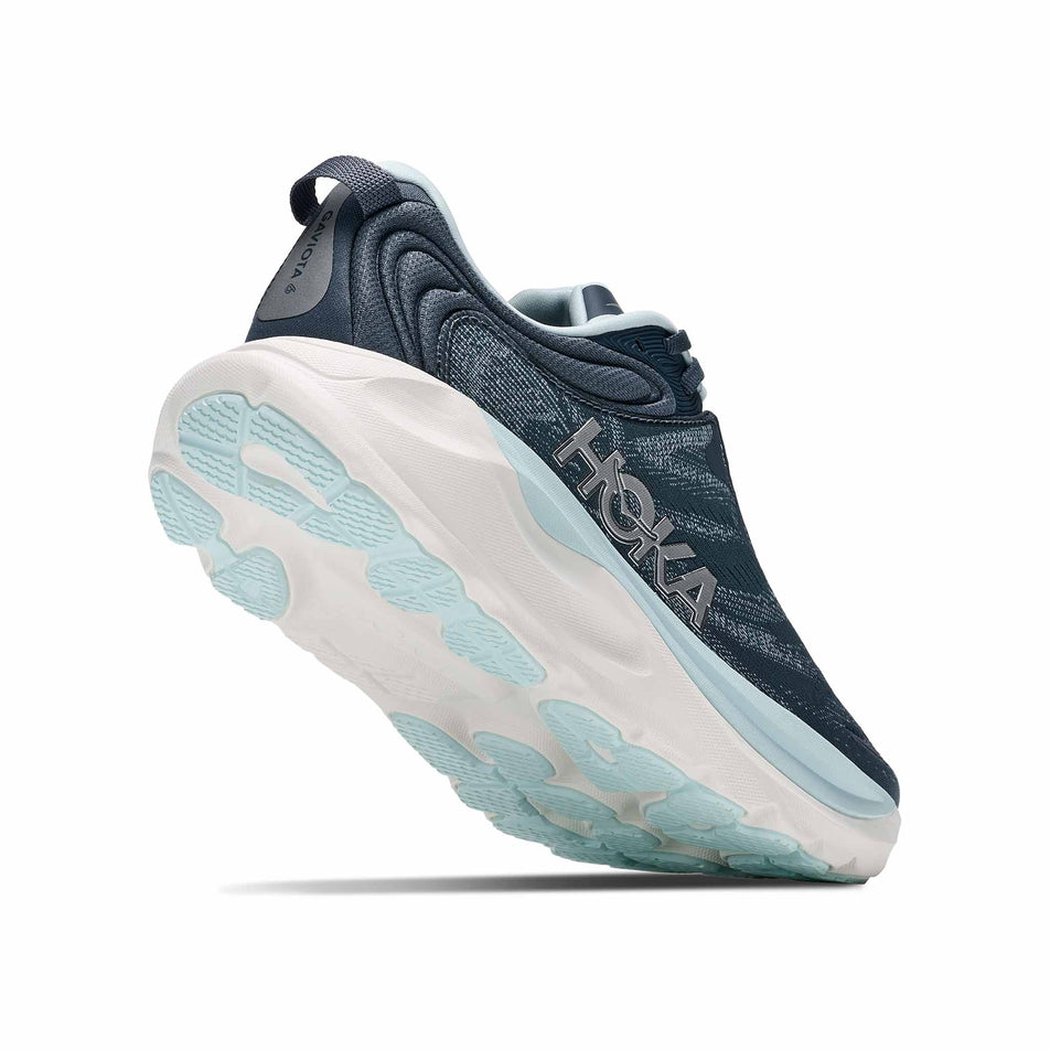 Lateral - and outsole - view of the right shoe from a pair of HOKA Women's Gaviota 6 Running Shoes in the Faded Navy/Glimmering Blue colourway.
