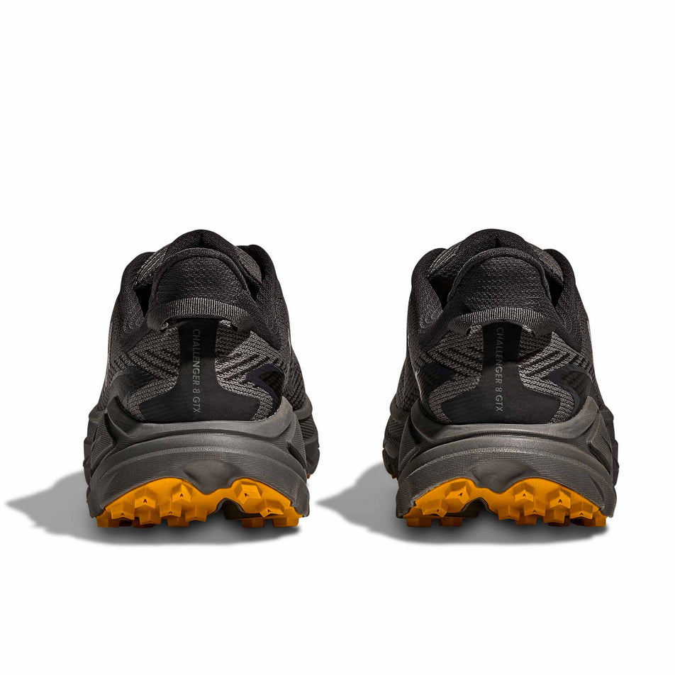 The back of a pair of HOKA Men's Challenger 8 GTX Running Shoes in the Asphalt Grey/Varsity Yellow colourway.