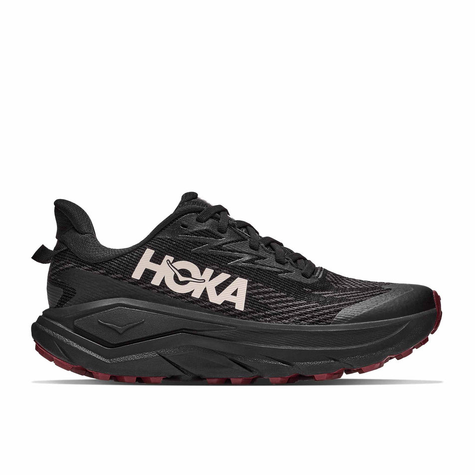 Lateral view of the right shoe from a pair of HOKA Women's Challenger 8 GTX Trail Running Shoes in the Black/Varsity Burgundy colourway.