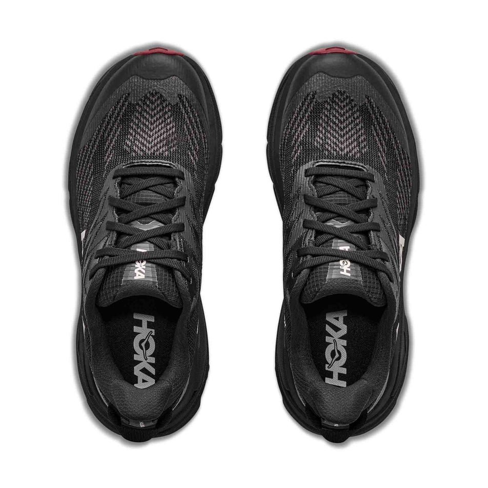 The uppers of a pair of HOKA Women's Challenger 8 GTX Trail Running Shoes in the Black/Varsity Burgundy colourway.