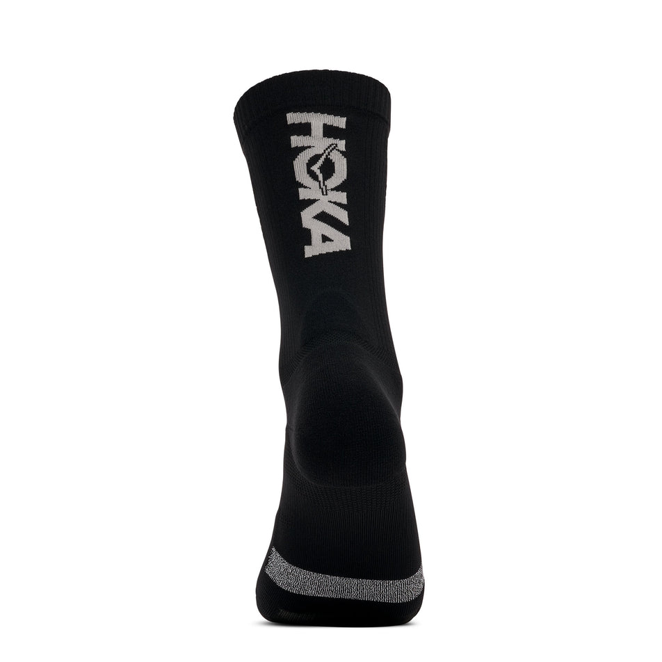 Back view of one of the socks from a pair of HOKA Unisex Race Day Crew Sock in the Black colourway.