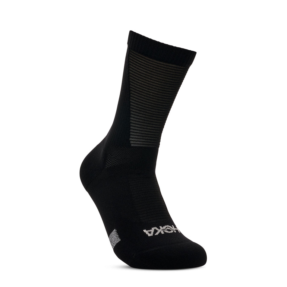 Angled view of one of the socks from a pair of HOKA Unisex Race Day Crew Sock in the Black colourway.