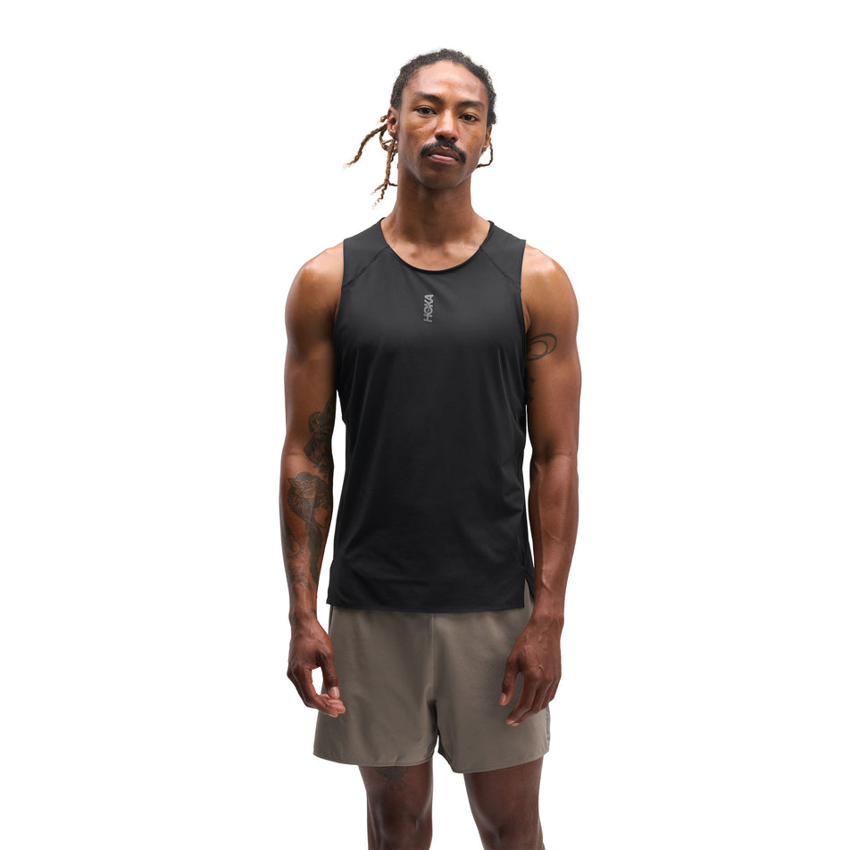 Front view of a model wearing the HOKA Men's Everyrun Tank in the Black colourway.