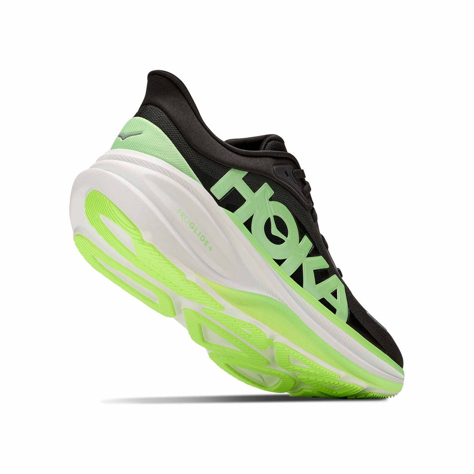 Lateral - and outsole - view of the right shoe from a pair of HOKA Men's Clifton Pro Running Shoes in the Carbon Black/Tart Apple colourway.