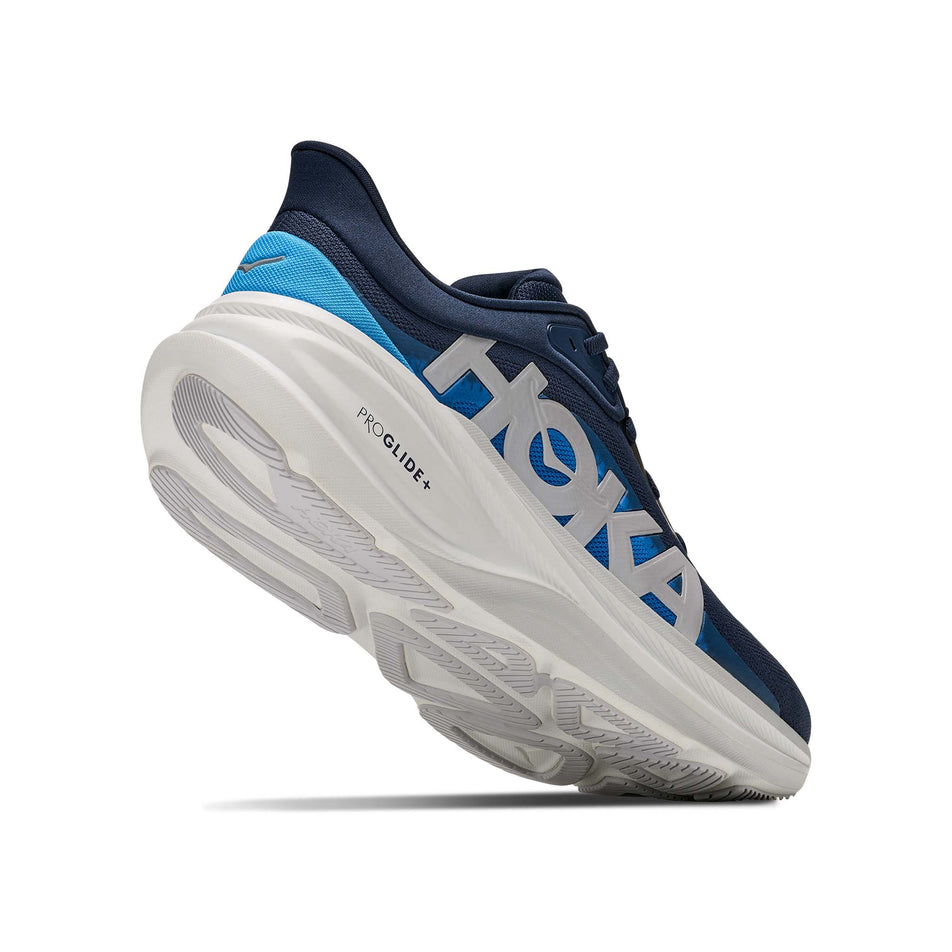 Lateral - and outsole - view of the right shoe from a pair of HOKA Men's Clifton Pro Running Shoes in the Varsity Navy/Soft Cobalt colourway.