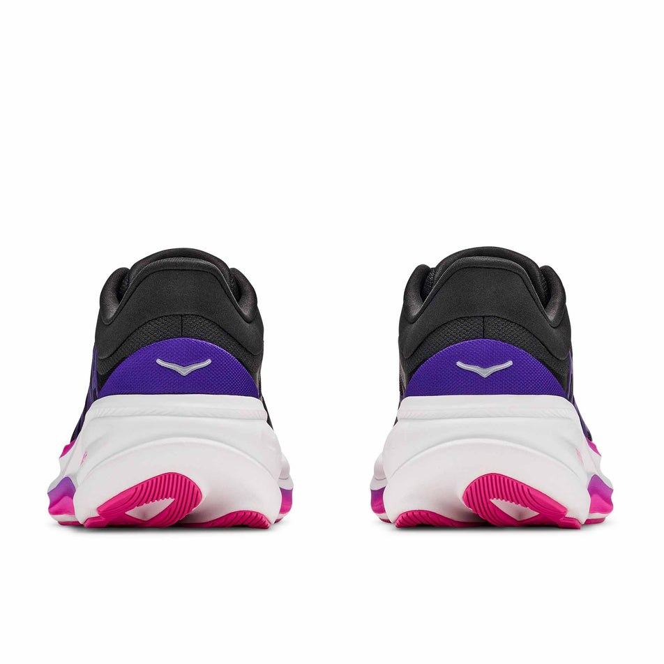 The back of a pair of HOKA Women's Clifton Pro Running Shoes in the Carbon Black/Cosmic Purple colourway.