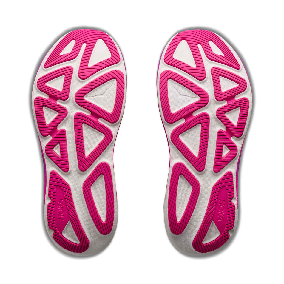 The outsoles of a pair of HOKA Women's Clifton Pro Running Shoes in the Carbon Black/Cosmic Purple colourway.