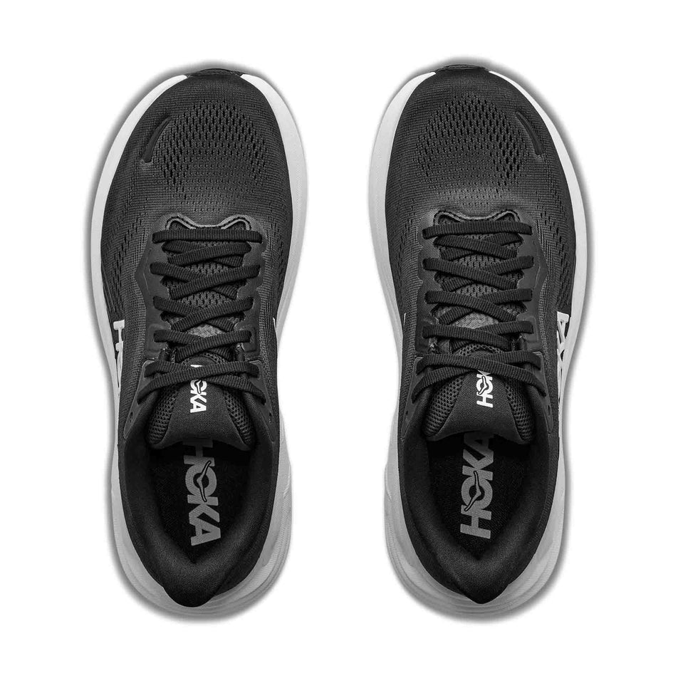 The uppers of a pair of HOKA Women's Clifton 11 Running Shoes in the Black/White colourway.