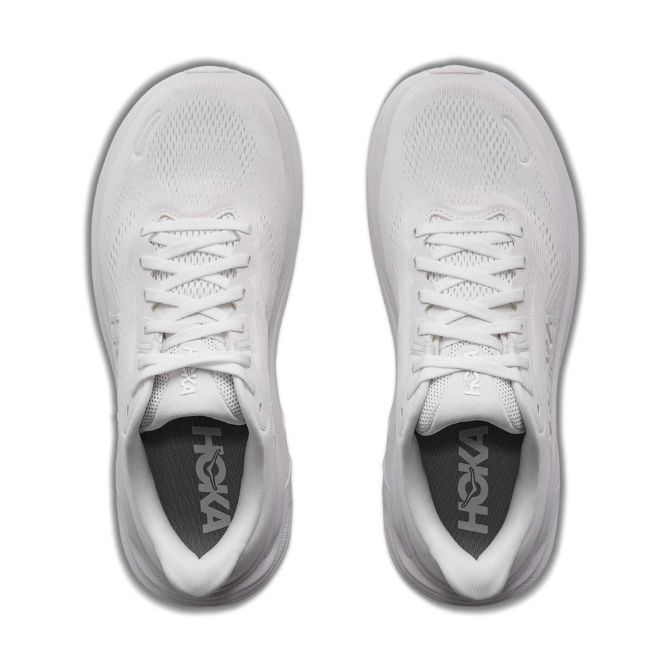 The uppers of a pair of HOKA Women's Clifton 11 Running Shoes in the White/White colourway.