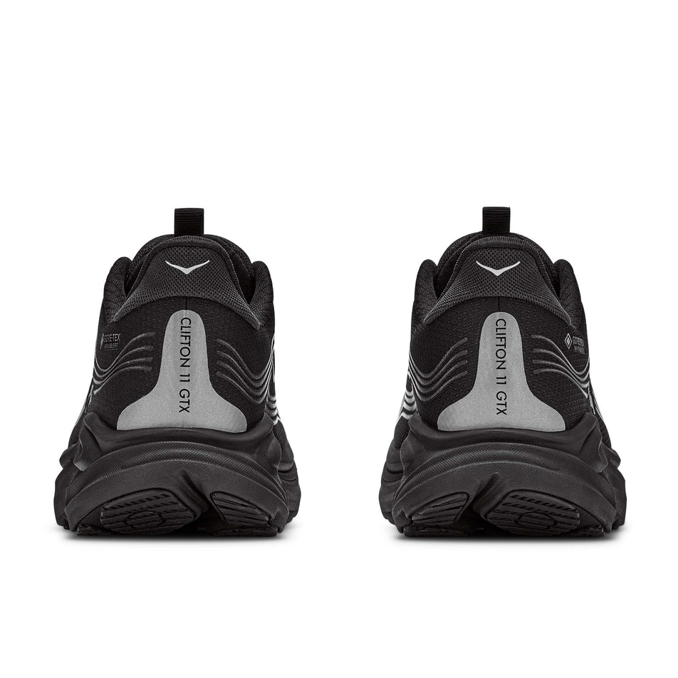 The back of a pair of HOKA Women's Clifton 11 GTX Running Shoes in the Black/Black colourway.