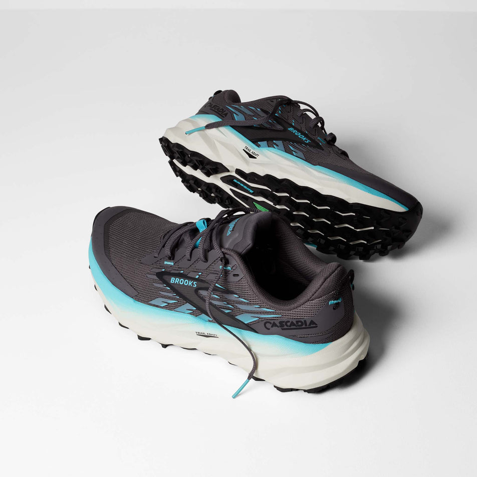 A pair of Brooks Women's Cascadia 19 Running Shoes in the Rabbit/Black/Bluefish colourway.