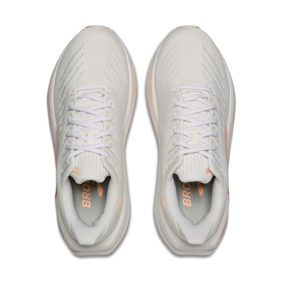 The uppers of a pair of Brooks Women's Glycerin Max 2 Running Shoes in the White/Coral/Peach colourway.
