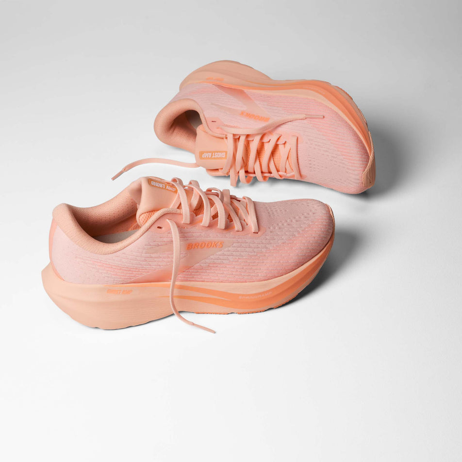 A pair of Brooks Women's Ghost AMP Running Shoes in the Peach/Peach/White colourway.