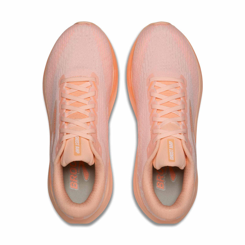 The uppers of a pair of Brooks Women's Ghost AMP Running Shoes in the Peach/Peach/White colourway.