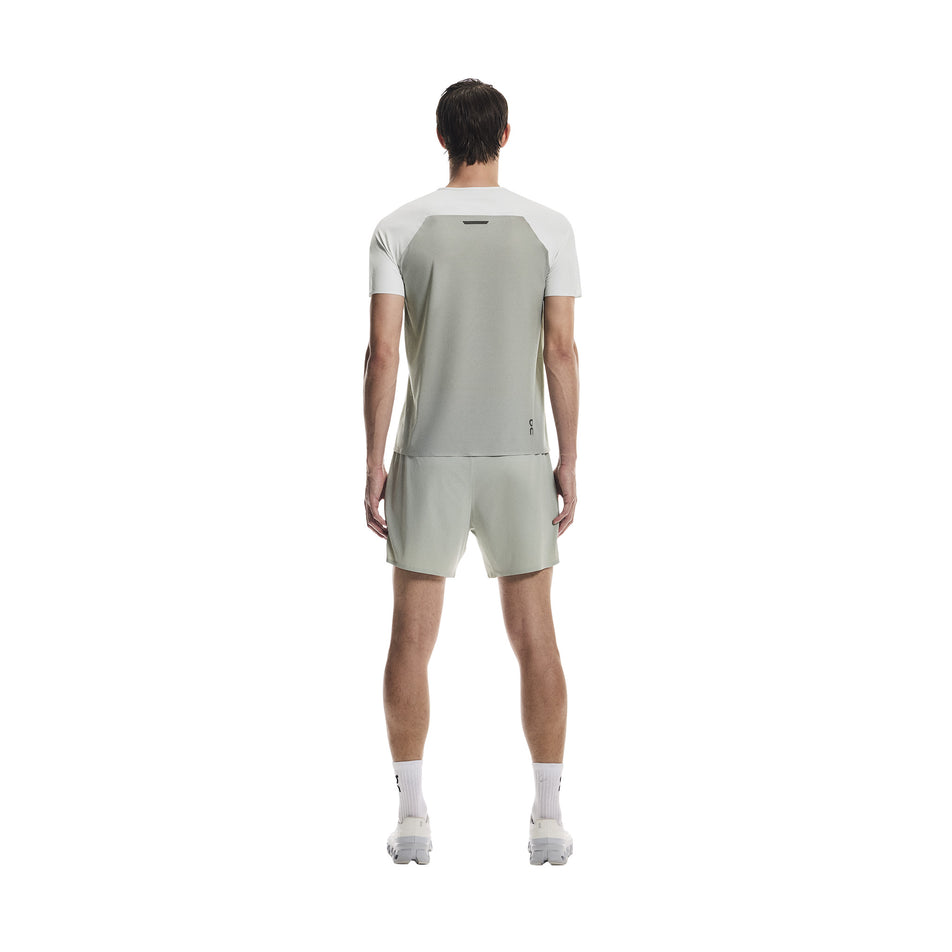Back view of a model wearing the On Men's Performance-T in the Iceberg/Tin colourway.