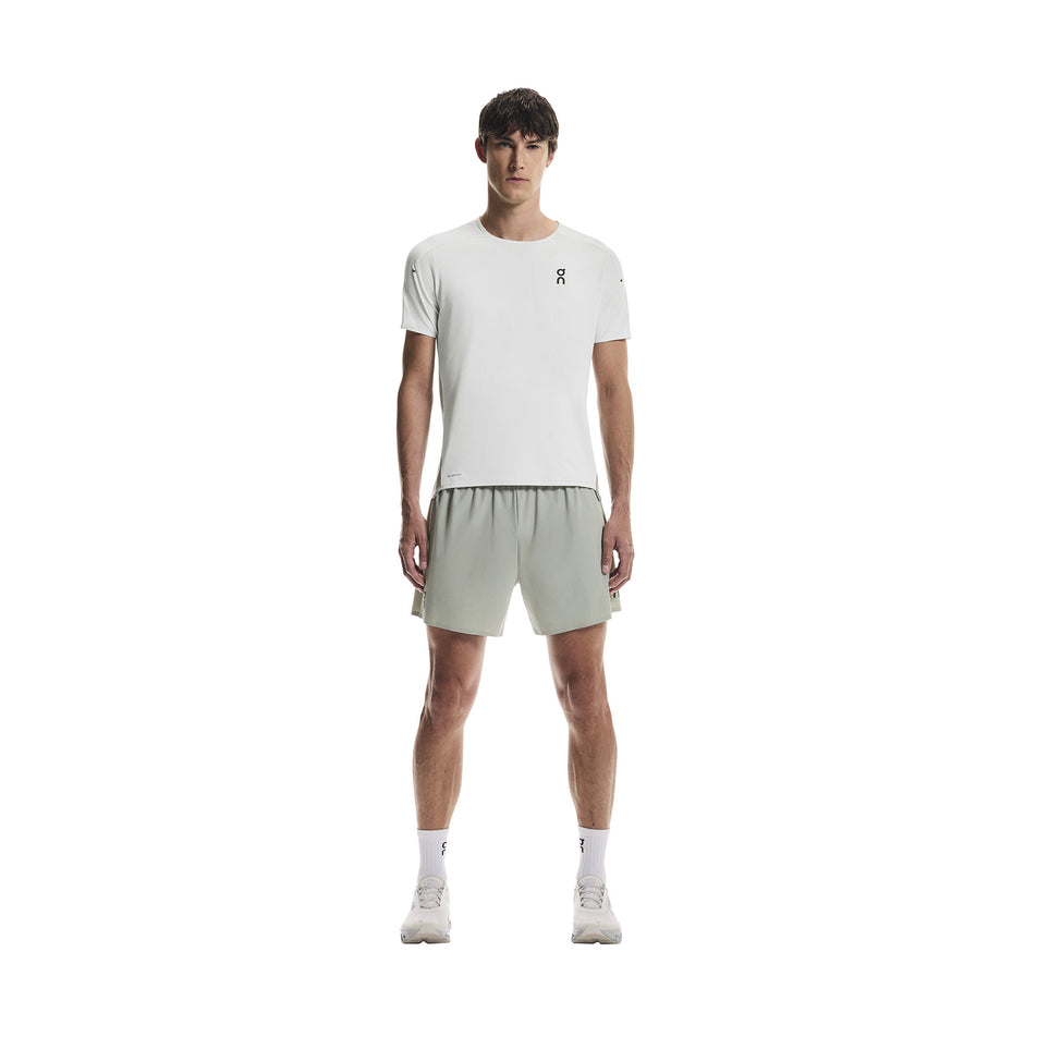 Front view of a model wearing the On Men's Performance-T in the Iceberg/Tin colourway.
