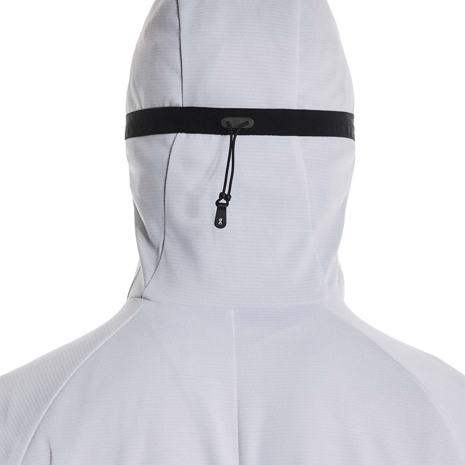 Back view of a model wearing the On Men's Climate Zip Hoodie in the White colourway.