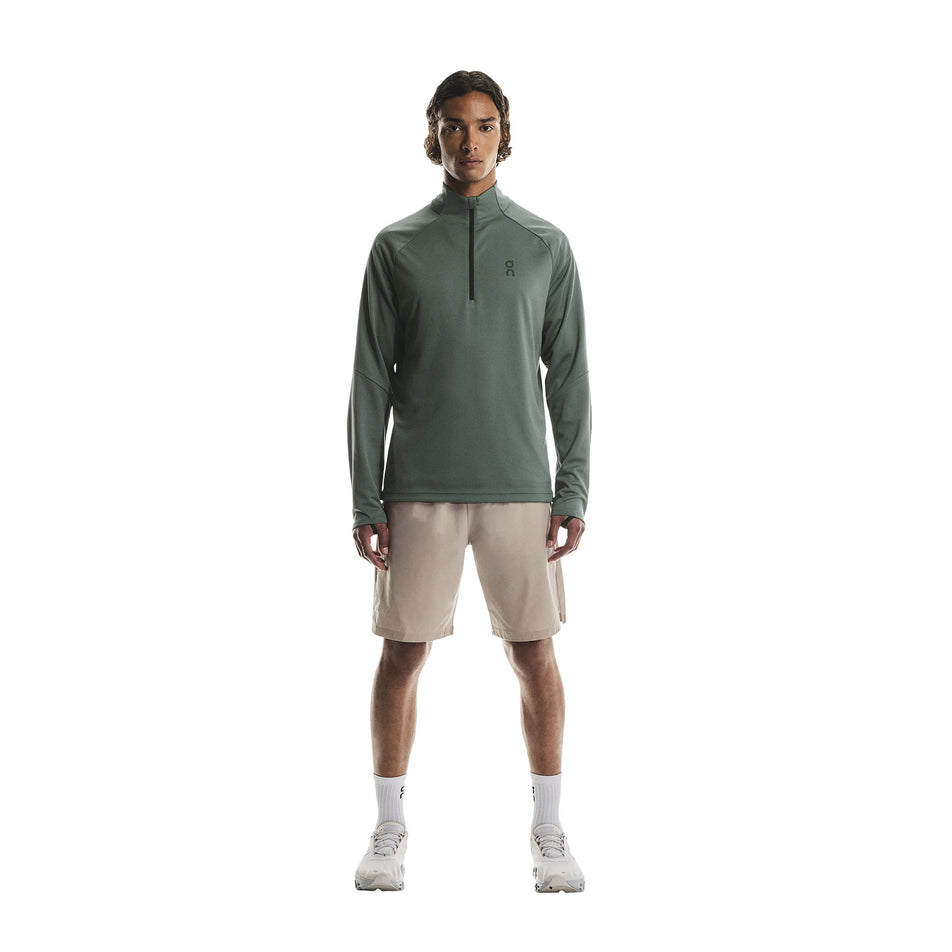 Front view of a model wearing the On Men's Climate Shirt in the Olive colourway. (8790094643362)
