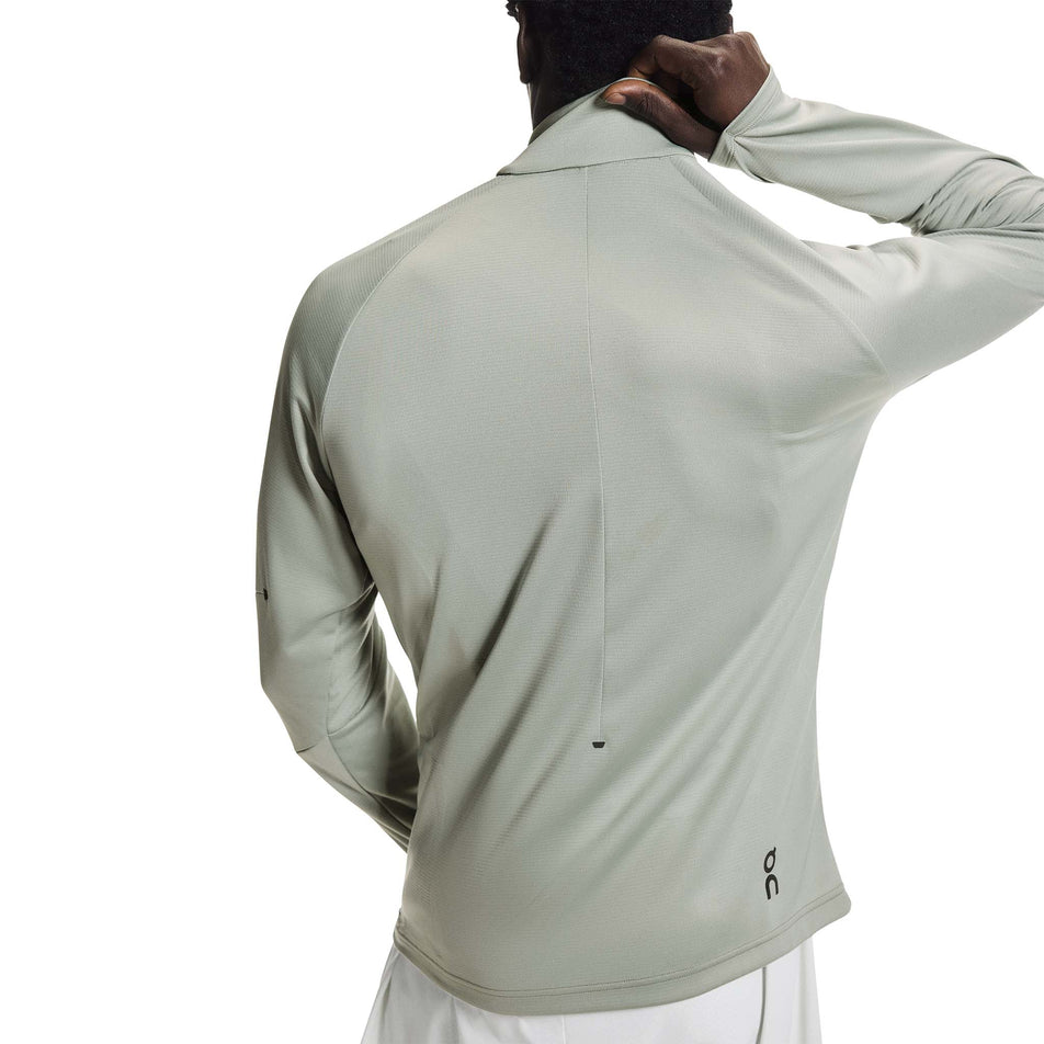 Back view of a model wearing the On Men's Climate Shirt in the Tin colourway.