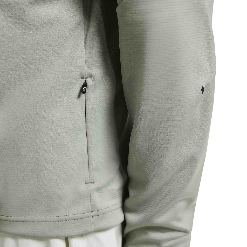 The zip pocket on the On Men's Climate Shirt in the Tin colourway.