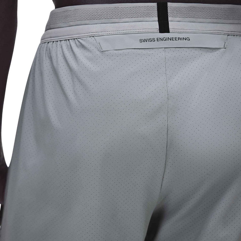Back view of a model wearing the On Men's 7
