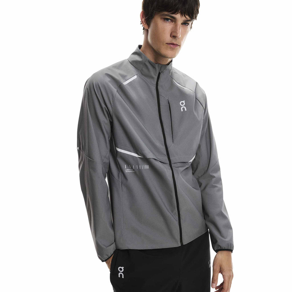 Front view of a model wearing the On Men's Weather Jacket Lumos in the Eclipse colourway. (8790125510818)