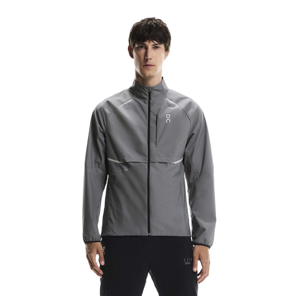 Front view of a model wearing the On Men's Weather Jacket Lumos in the Eclipse colourway. (8790125510818)