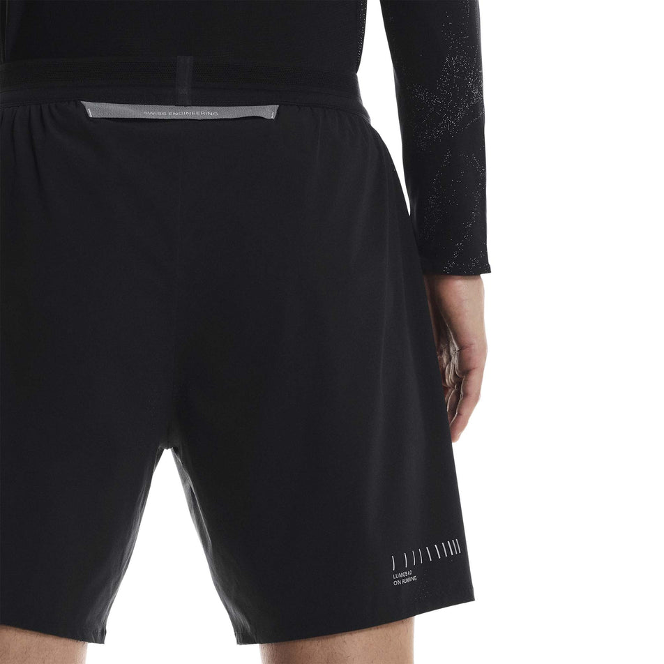 Front view of a model wearing the On Men's Performance Shorts Lumos in the Eclipse/Black colourway. (8790133473442)