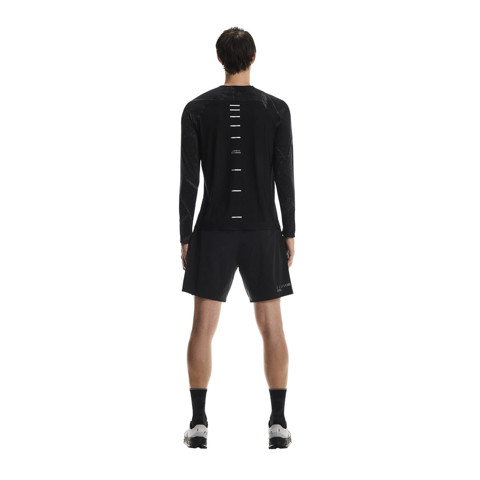 Back view of a model wearing the On Men's Performance Shorts Lumos in the Eclipse/Black colourway. (8790133473442)