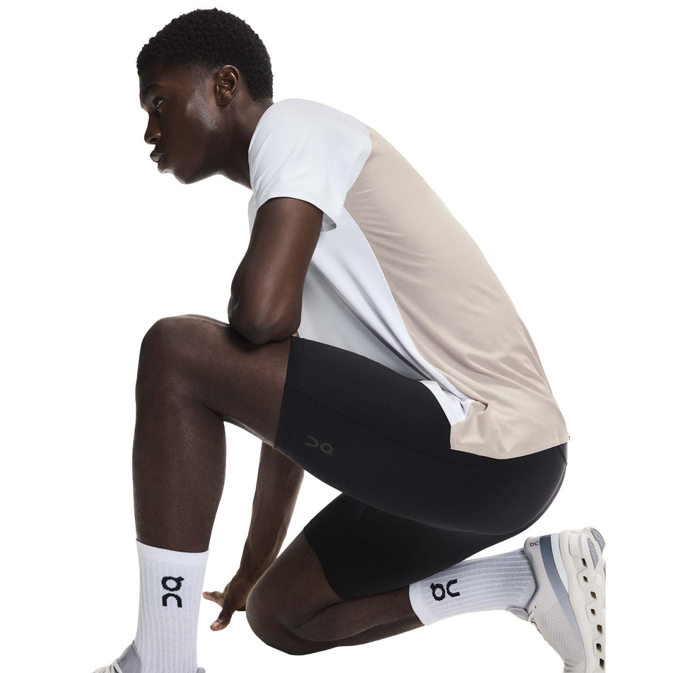 Angled view of a model wearing the On Men's 8