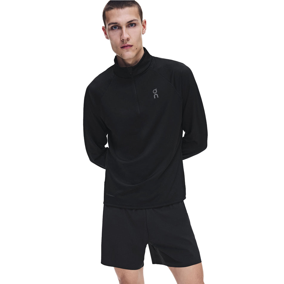 Front view of a model wearing the On Men's Climate Shirt 3.0 in the Black colourway.