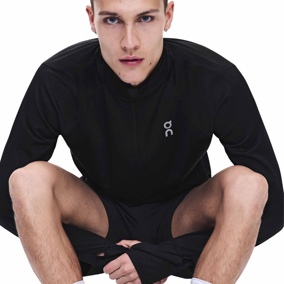 Front view of a model wearing the On Men's Climate Shirt 3.0 in the Black colourway.