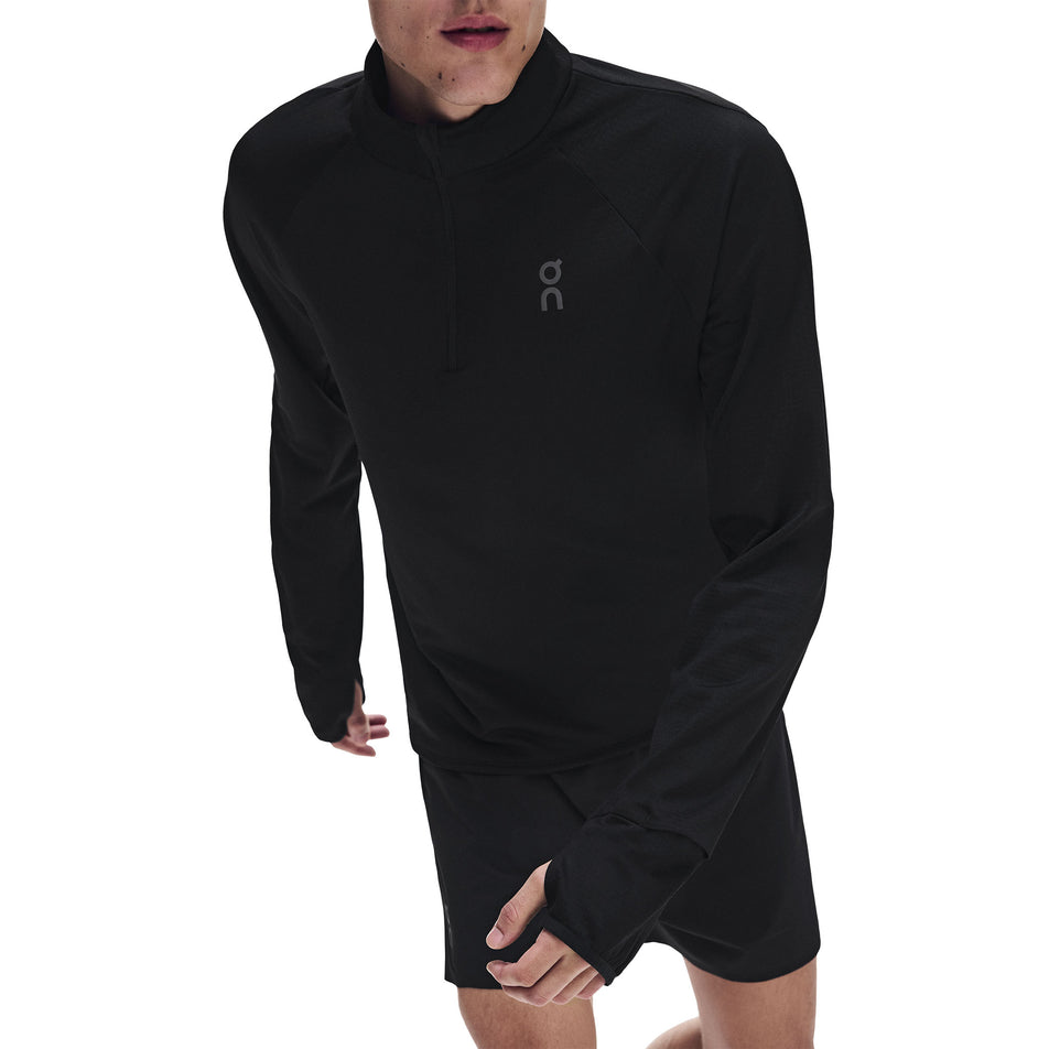 Front view of a model wearing the On Men's Climate Shirt 3.0 in the Black colourway.