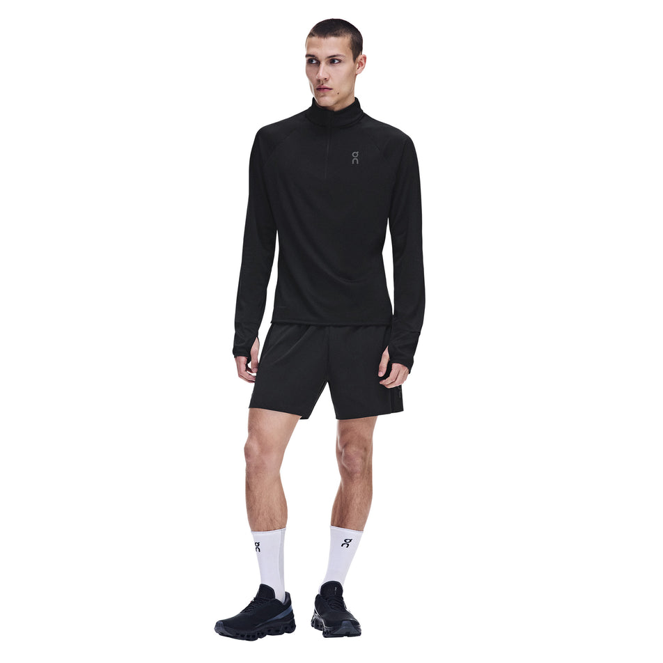 Front view of a model wearing the On Men's Climate Shirt 3.0 in the Black colourway.