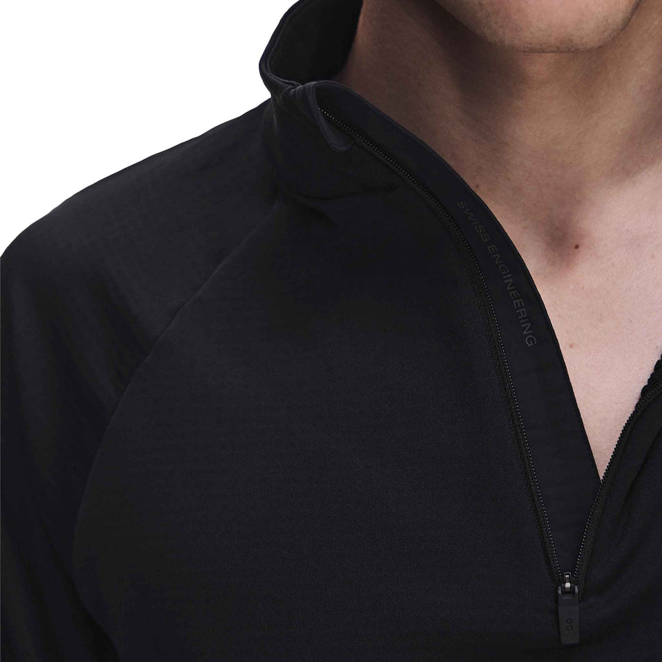 Close-up view of the zip on the On Men's Climate Shirt 3.0 in the Black colourway.