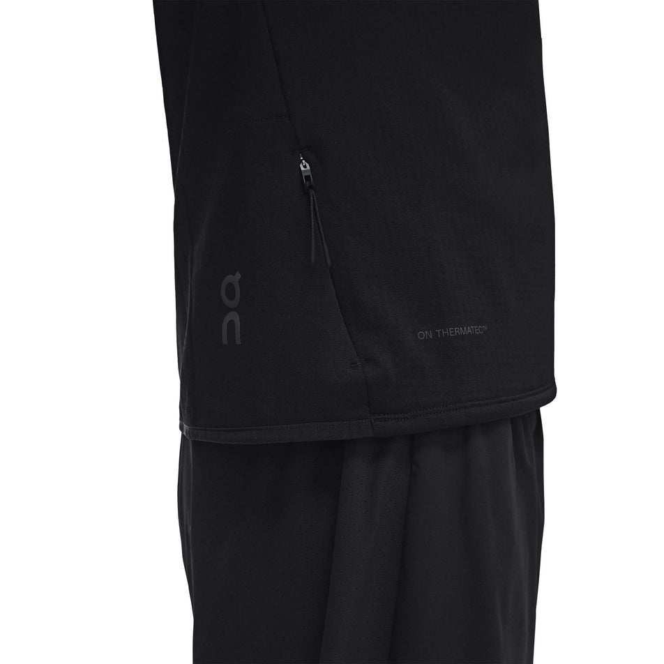 The side zip pocket on the On Men's Climate Shirt 3.0 in the Black colourway.