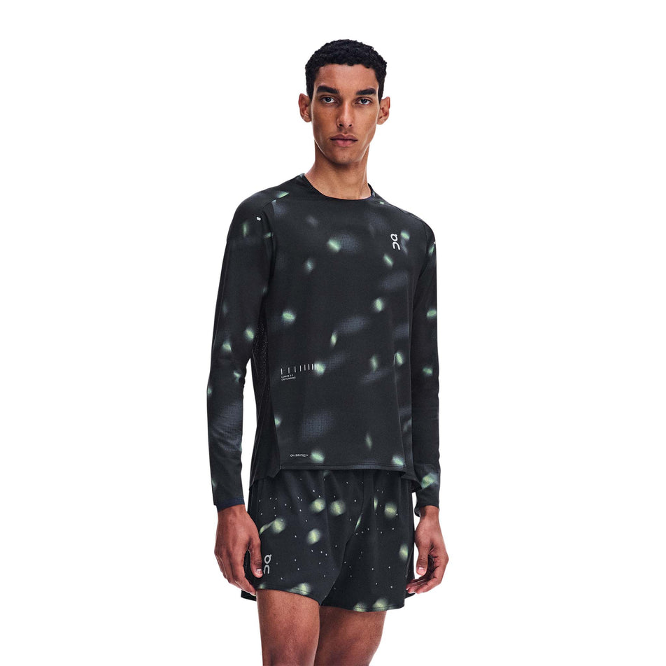 Front view of a model wearing the On Men's Performance Shorts Lumos 2.0 in the Black colourway.