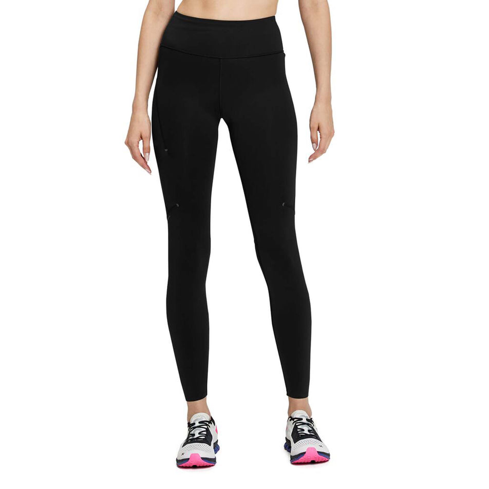 Front view of a model wearing a pair of On Women's Performance Tights in the black colourway (8002755264674)