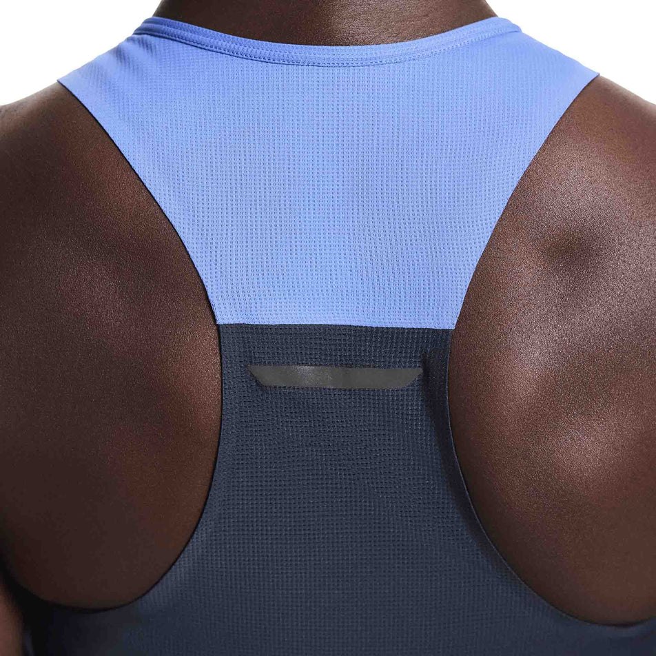 Back view of a model wearing the On Women's Performance Tank in the Sailor/Navy colourway. 