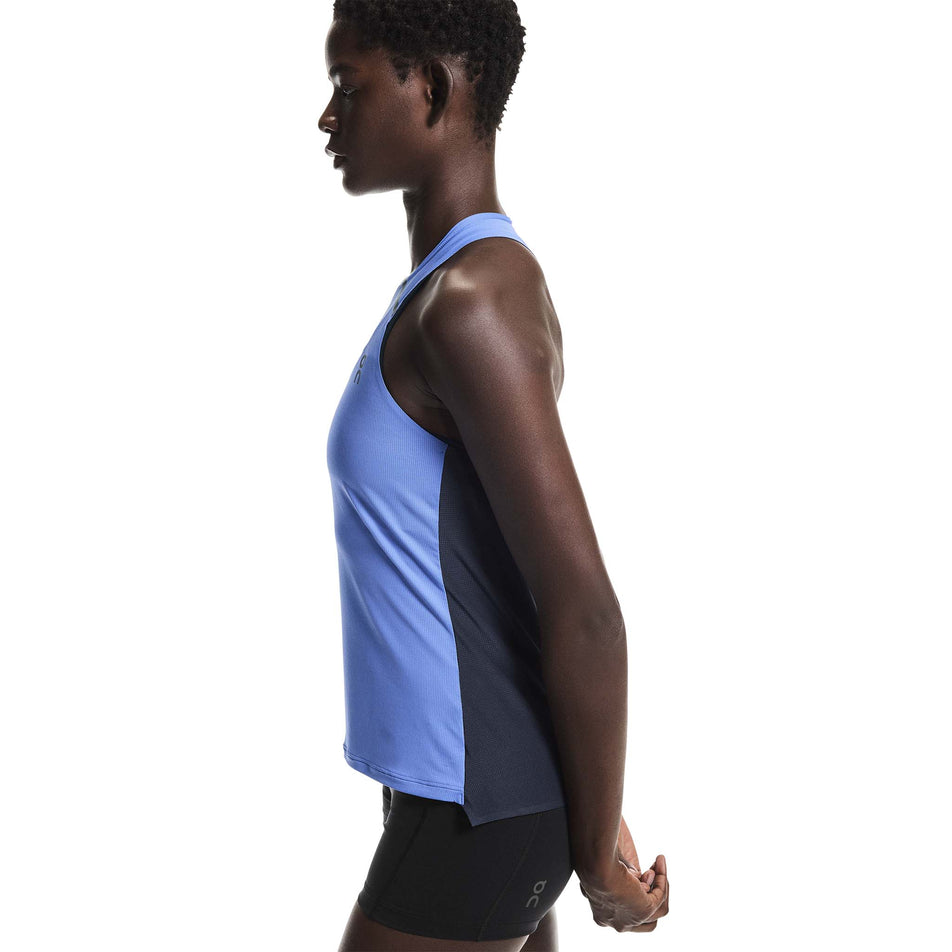 Side view of a model wearing the On Women's Performance Tank in the Sailor/Navy colourway. 