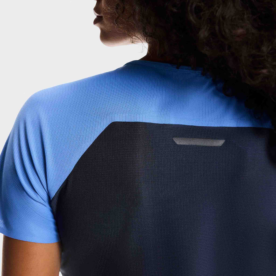 Back view of a model wearing the On Women's Performance-T in the Sailor/Navy colourway.