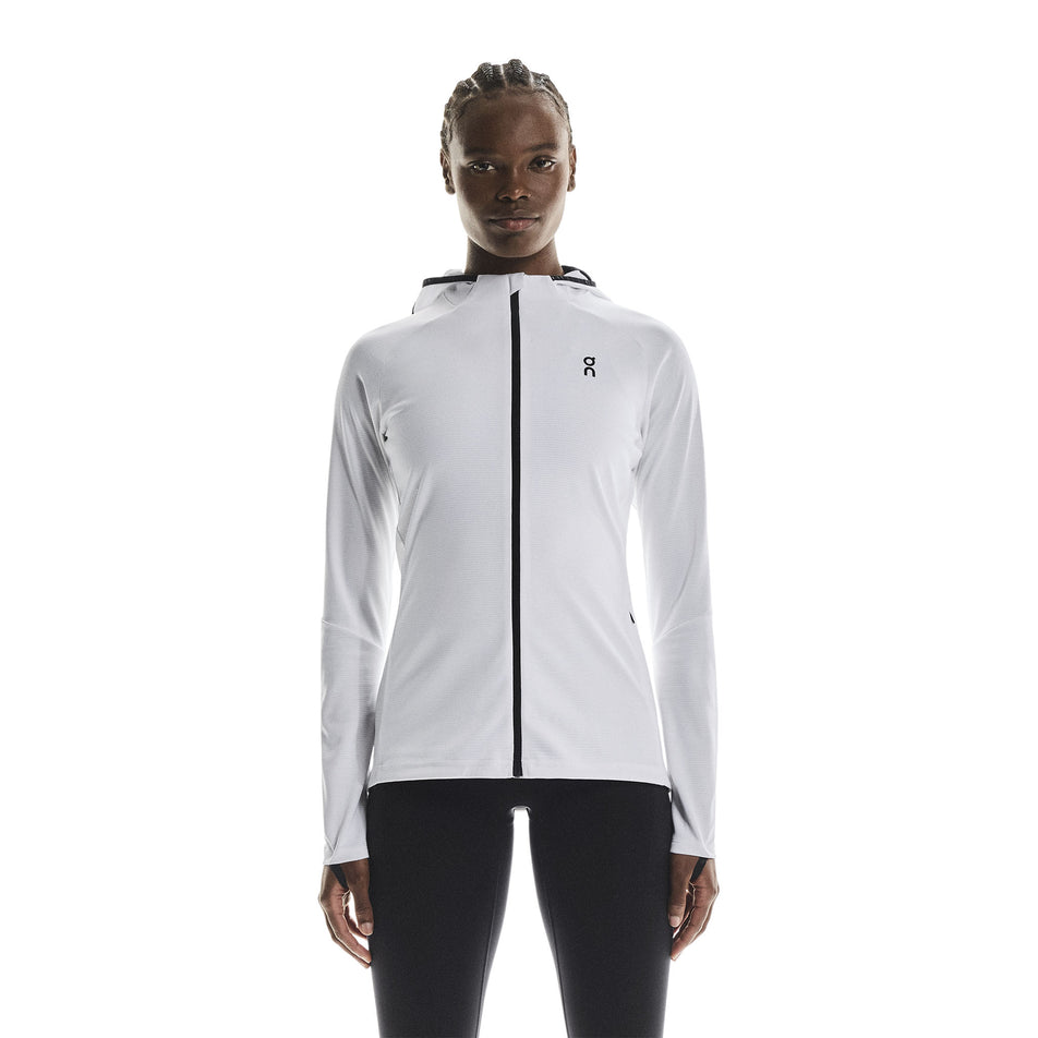 Front view of a model wearing the On Women's Climate Zip Hoodie in the White colourway.