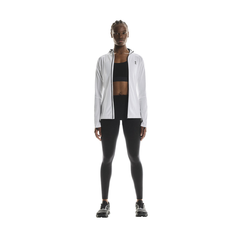 Front view of a model wearing the On Women's Performance Tights in the Black colourway.
