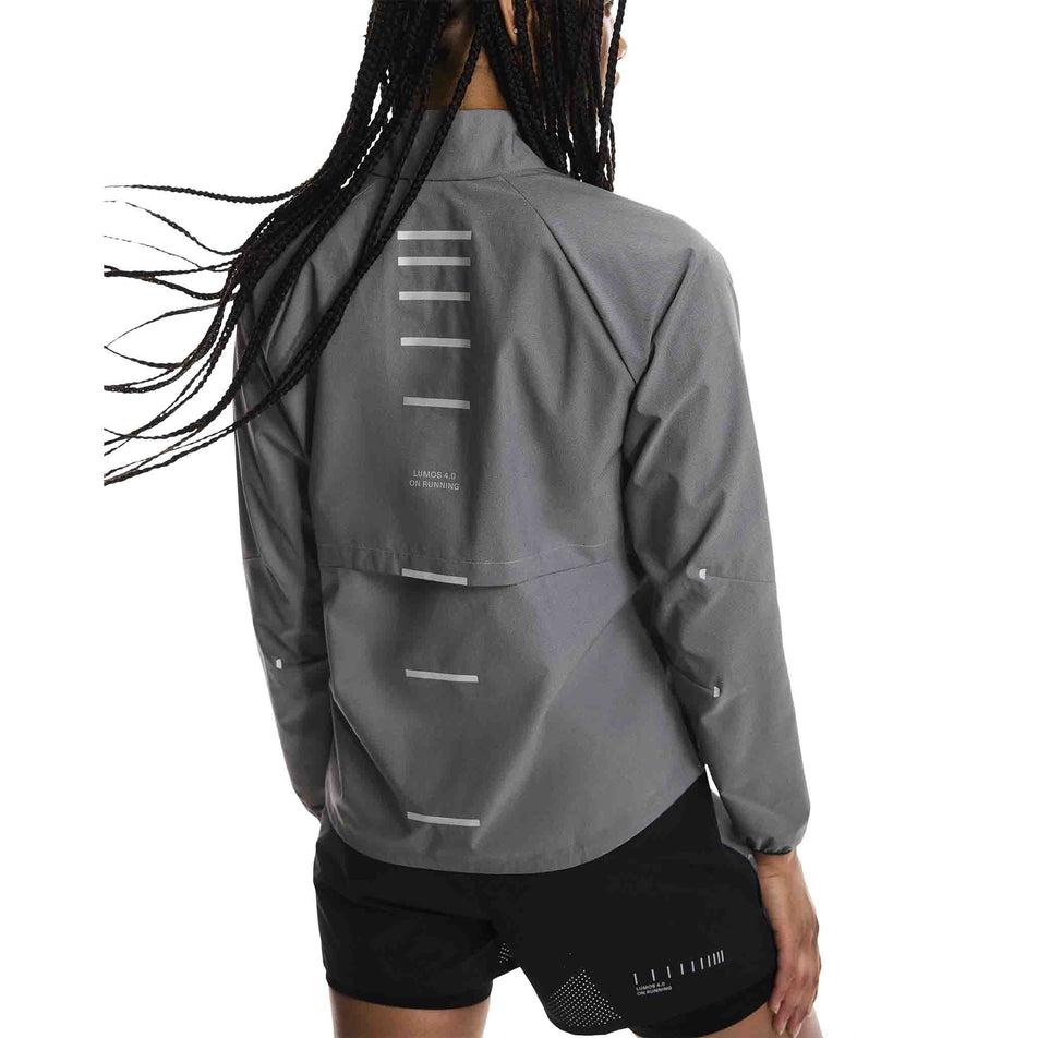 Back view of a model wearing the On Women's Weather Jacket Lumos in the Eclipse colourway. (8790034808994)